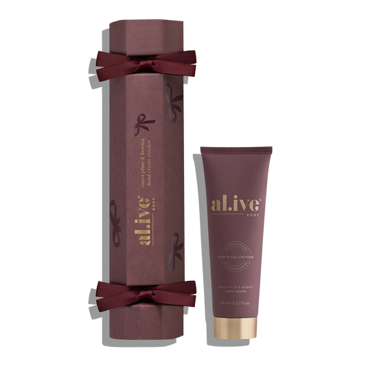 Maroon gift box with a tube of 'al.ive' body product on a white background