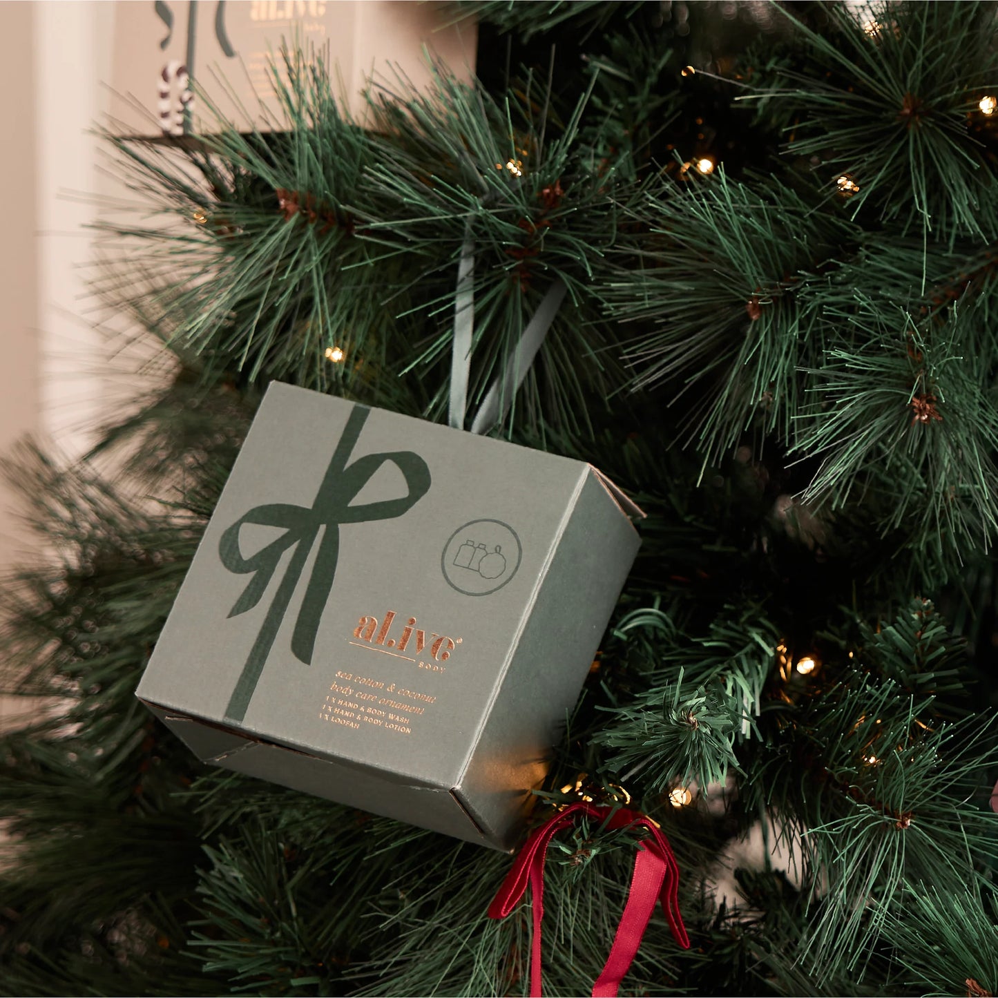 Gift box with a bow on a Christmas tree