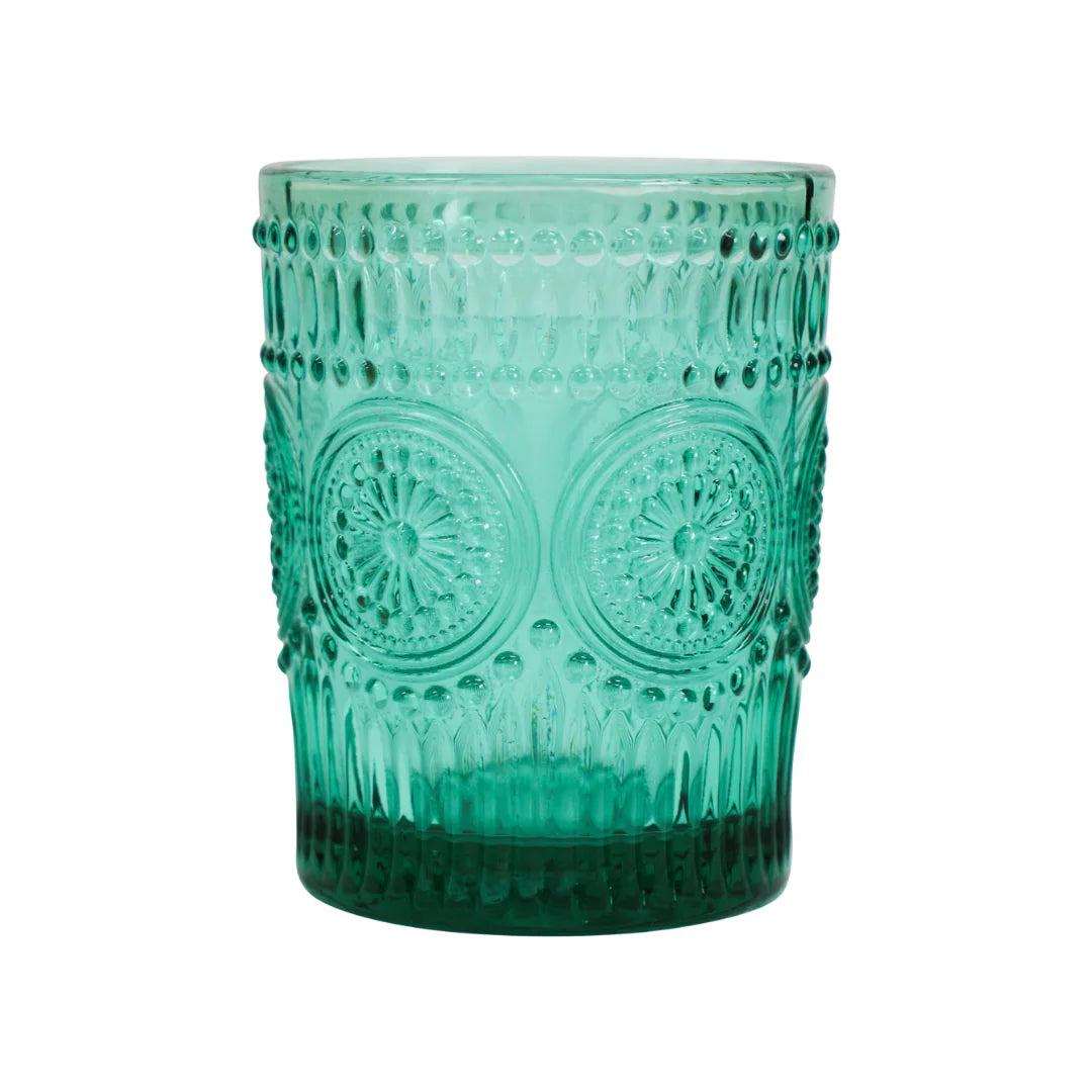 A textured green glass tumbler with embossed circular floral patterns and vertical ribbing, shown on a plain white background.